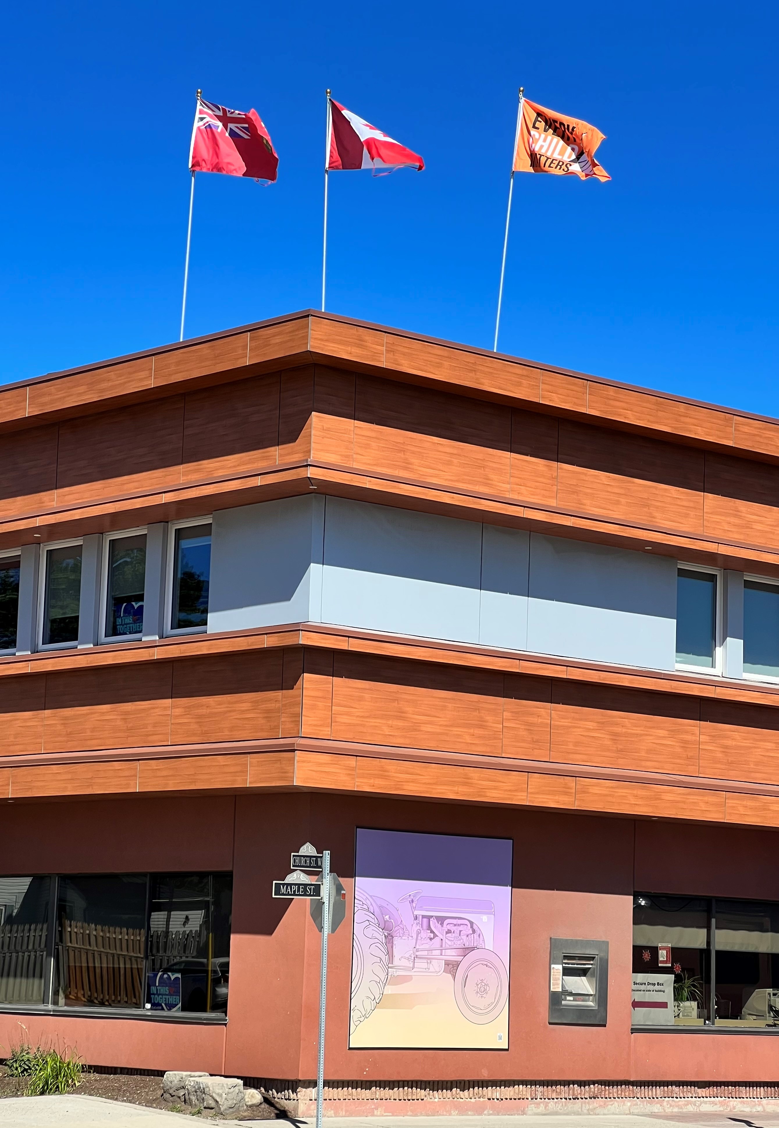 flags on top of the township administration building