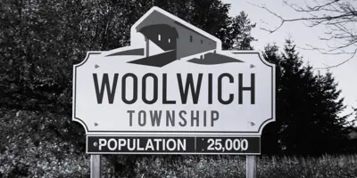 The Township of Woolwich Sign that Reads: Woolwich Township, Population 25,000